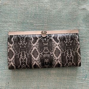 Bebe Snakeskin-patterned Evening Clutch.